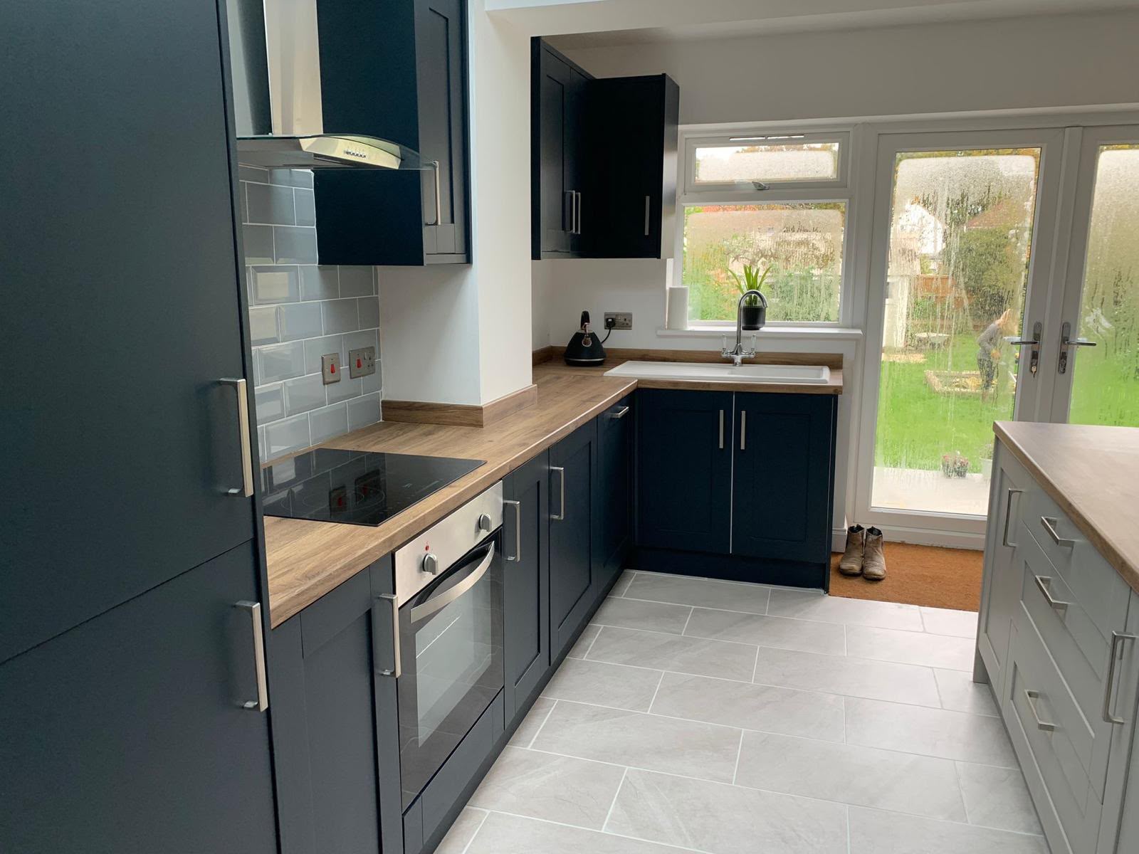 Finished navy fitted kitchen by DR Smith Building, Wiltshire.