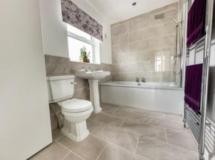 Completed tiled family bathroom fit-out by DR Smith Building general builders.
