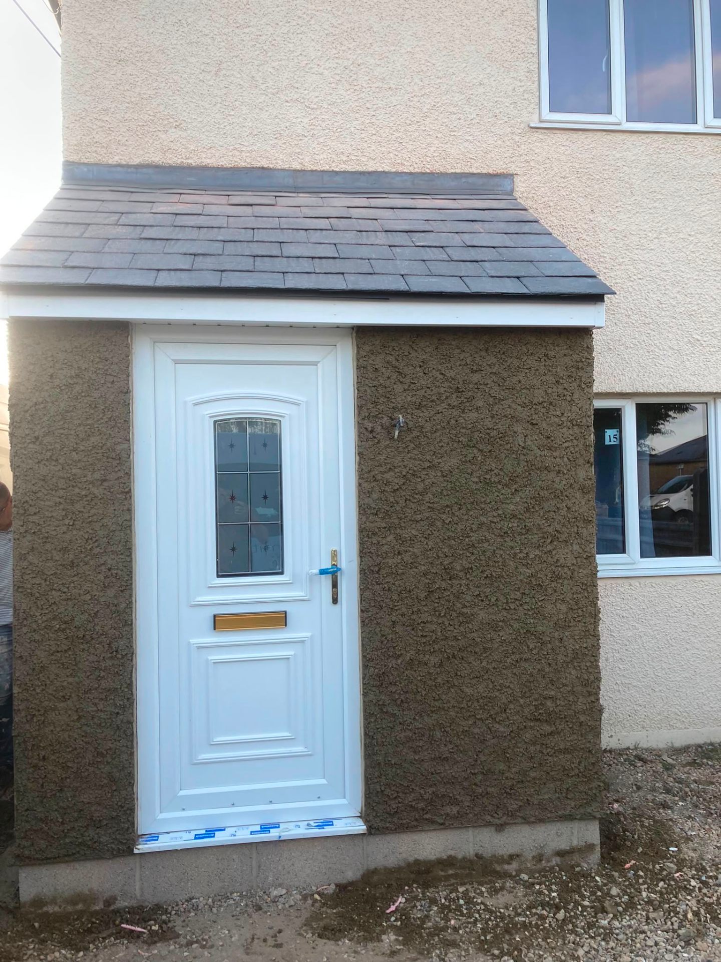 New pitched natural slate roof on a porch extension, installed by DR Smith Building.